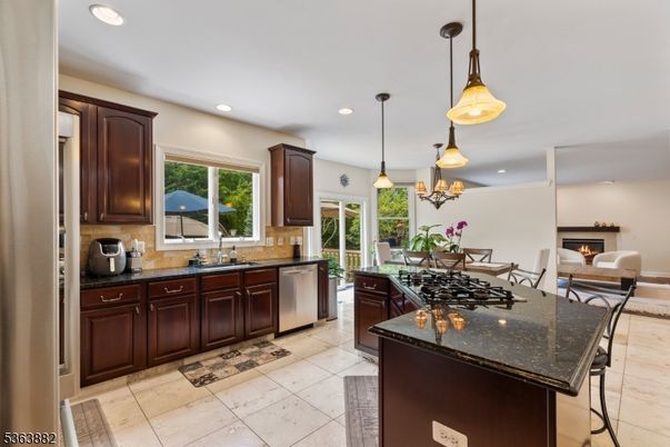 Dining room, Fireplace, Interior, Kitchen, Pendant Lights, Recessed Lighting, Stainless Steel Appliances