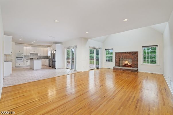 Empty room, Fireplace, Interior, Kitchen, Pendant Lights, Recessed Lighting, Wood Texture Flooring