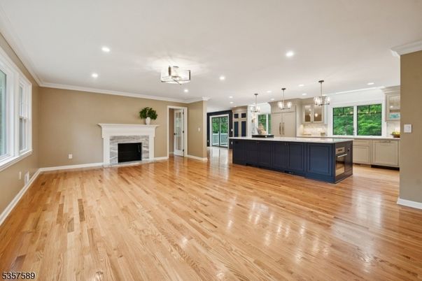 Empty room, Fireplace, Interior, Kitchen, Pendant Lights, Recessed Lighting, Wood Texture Flooring