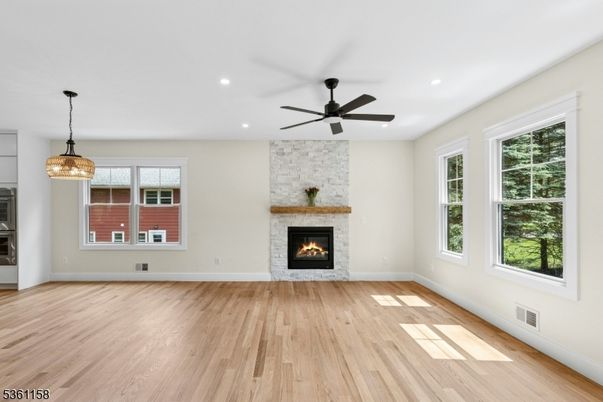 Empty room, Fireplace, Interior, Pendant Lights, Recessed Lighting, Stone Walls, Wood Texture Flooring