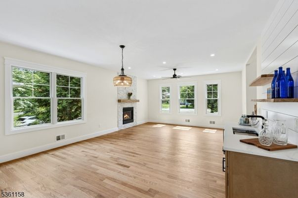 Empty room, Fireplace, Interior, Pendant Lights, Recessed Lighting, Wood Texture Flooring
