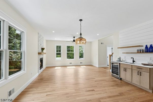 Empty room, Fireplace, Interior, Kitchen, Pendant Lights, Recessed Lighting, Wood Texture Flooring