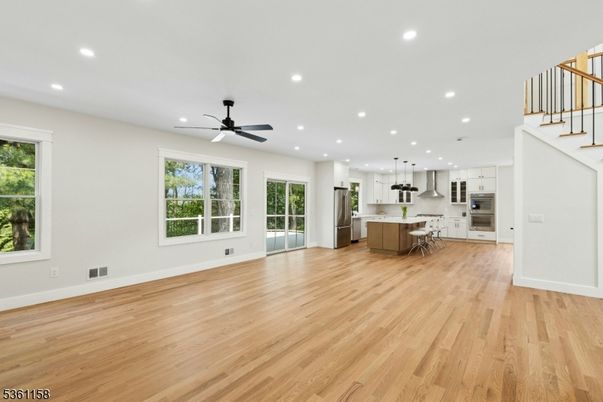 Empty room, Interior, Kitchen, Pendant Lights, Recessed Lighting, Stainless Steel Appliances, Wood Texture Flooring