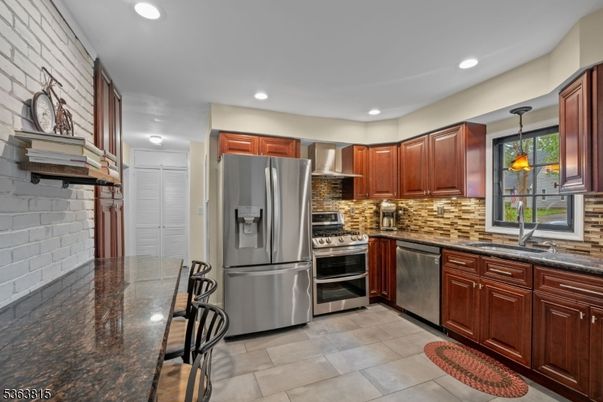 Interior, Kitchen, Pendant Lights, Recessed Lighting, Stainless Steel Appliances, Stone Walls