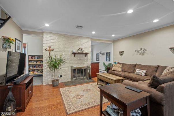 Fireplace, Interior, Living room, Recessed Lighting, Stone Walls, Wood Texture Flooring
