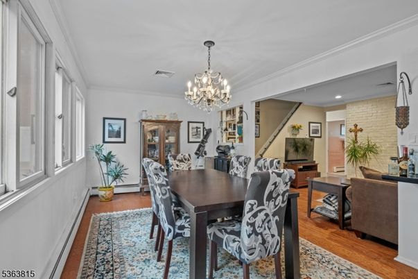 Chandelier, Dining room, Interior, Recessed Lighting, Stone Walls, Wood Texture Flooring