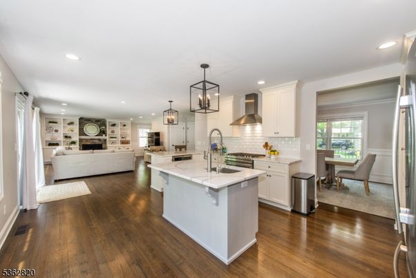 Dining room, Fireplace, Interior, Kitchen, Living room, Pendant Lights, Recessed Lighting, Stainless Steel Appliances, Wood Texture Flooring