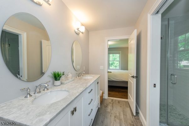 Bathroom, Dual Sink Vanities, Glass Shower, Interior, Wood Texture Flooring