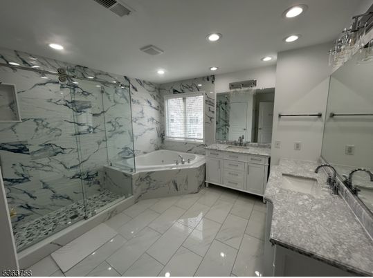 Bathroom, Dual Sink Vanities, Glass Shower, Interior, Marble, Marble Walls, Recessed Lighting