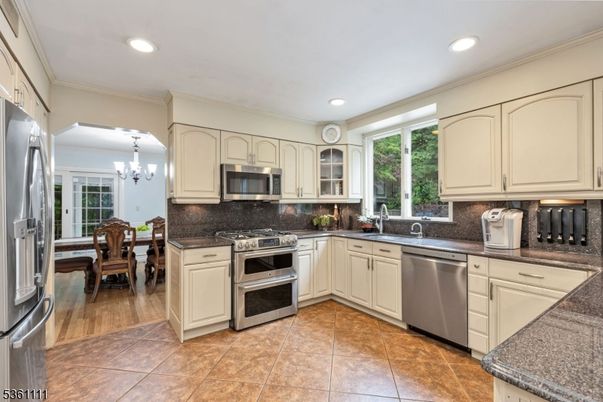 Chandelier, Dining room, Interior, Kitchen, Recessed Lighting, Stainless Steel Appliances, Wood Texture Flooring