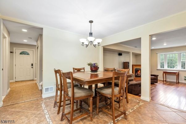 Chandelier, Dining room, Fireplace, Interior, Recessed Lighting, Wood Texture Flooring