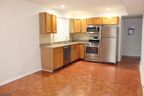 Interior, Kitchen, Recessed Lighting, Stainless Steel Appliances, Wood Texture Flooring