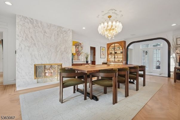 Chandelier, Dining room, Interior, Marble Walls, Recessed Lighting, Wood Texture Flooring