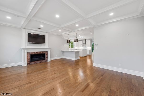 Empty room, Fireplace, Interior, Kitchen, Pendant Lights, Recessed Lighting, Wood Texture Flooring