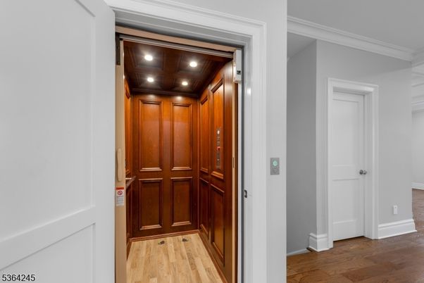 Elevator, Interior, Recessed Lighting, Wooden Ceilings, Wood Texture Flooring, Wooden Walls