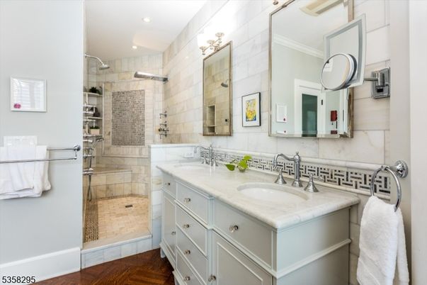 Bathroom, Dual Sink Vanities, Glass Shower, Interior, Recessed Lighting, Wood Texture Flooring