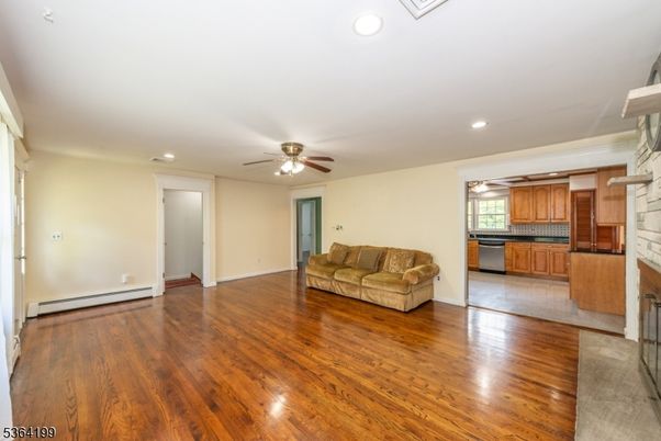 Empty room, Fireplace, Interior, Kitchen, Recessed Lighting, Wood Texture Flooring