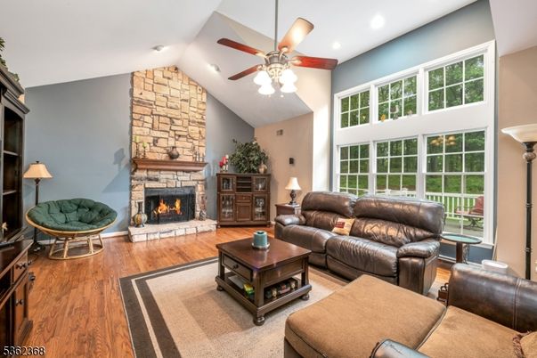 Fireplace, Interior, Living room, Recessed Lighting, Stone Walls, Wood Texture Flooring