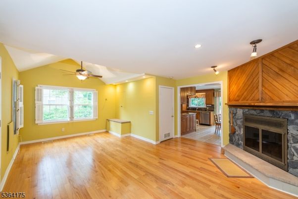 Empty room, Fireplace, Interior, Kitchen, Recessed Lighting, Wood Texture Flooring