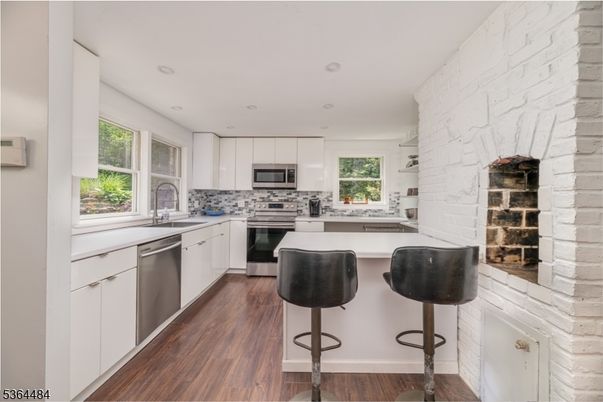 Interior, Kitchen, Recessed Lighting, Stainless Steel Appliances, Stone Walls, Wood Texture Flooring