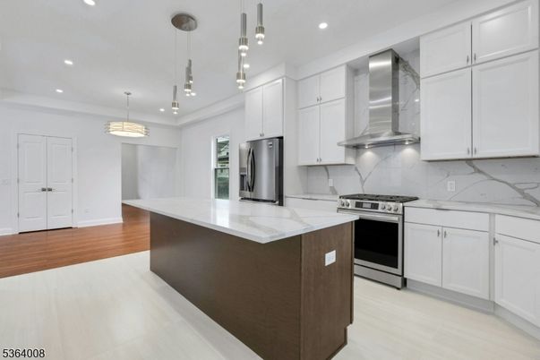 Interior, Kitchen, Marble Walls, Pendant Lights, Recessed Lighting, Stainless Steel Appliances, Wood Texture Flooring