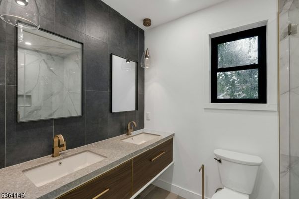 Bathroom, Dual Sink Vanities, Interior, Marble Walls, Recessed Lighting