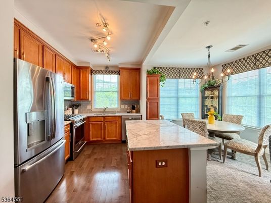 Chandelier, Dining room, Interior, Kitchen, Pendant Lights, Stainless Steel Appliances, Wood Texture Flooring
