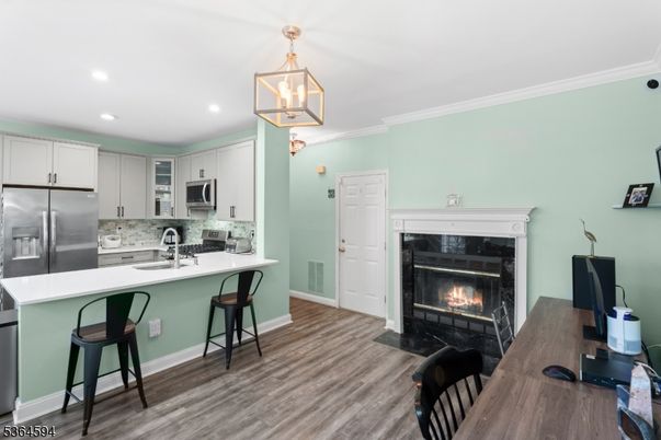 Fireplace, Interior, Kitchen, Pendant Lights, Recessed Lighting, Stainless Steel Appliances, Wood Texture Flooring