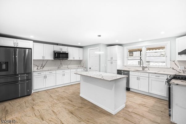 Interior, Kitchen, Marble Walls, Recessed Lighting, Stainless Steel Appliances, Wood Texture Flooring