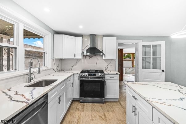 Interior, Kitchen, Marble Walls, Recessed Lighting, Stainless Steel Appliances, Wood Texture Flooring