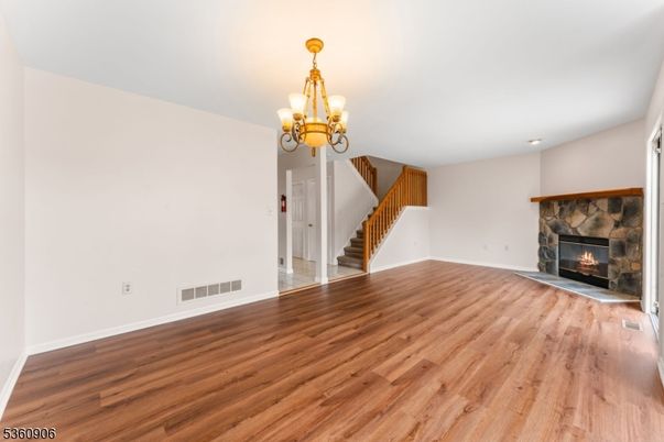 Chandelier, Empty room, Fireplace, Interior, Recessed Lighting, Wood Texture Flooring