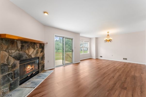 Chandelier, Empty room, Fireplace, Interior, Recessed Lighting, Wood Texture Flooring