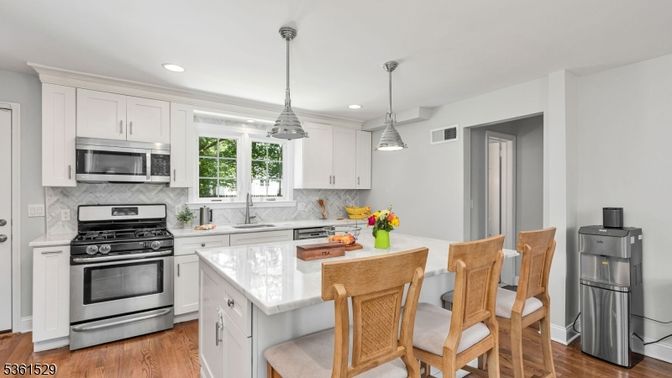 Interior, Kitchen, Pendant Lights, Recessed Lighting, Stainless Steel Appliances, Wood Texture Flooring