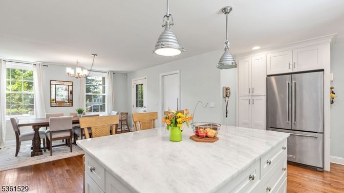 Chandelier, Dining room, Interior, Kitchen, Pendant Lights, Recessed Lighting, Stainless Steel Appliances, Wood Texture Flooring