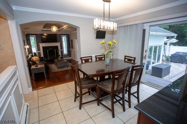 Chandelier, Dining room, Fireplace, Interior, Living room, Pendant Lights, Wood Texture Flooring