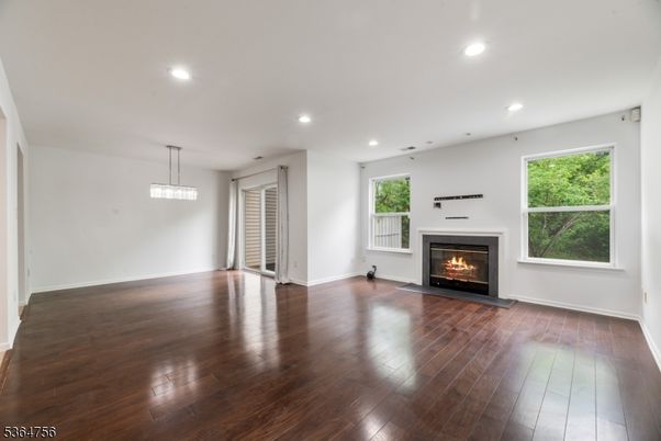 Empty room, Fireplace, Interior, Pendant Lights, Recessed Lighting, Wood Texture Flooring