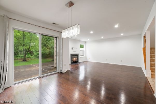 Chandelier, Empty room, Fireplace, Interior, Recessed Lighting, Wood Texture Flooring