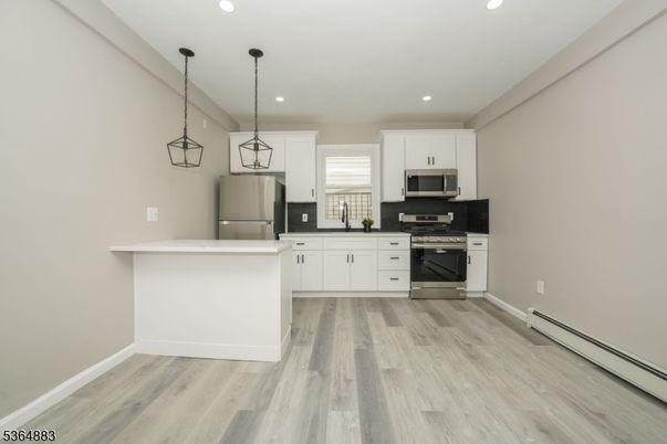 Interior, Kitchen, Pendant Lights, Recessed Lighting, Stainless Steel Appliances, Wood Texture Flooring