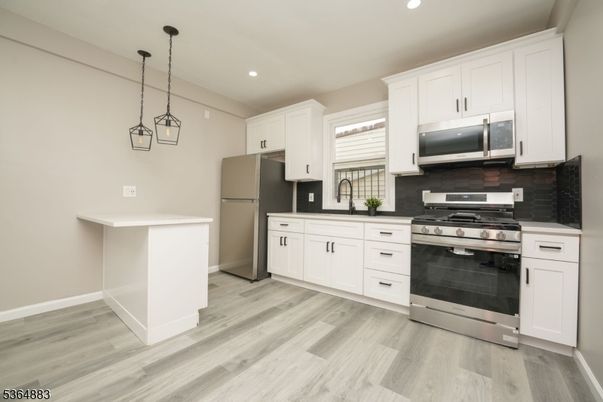 Interior, Kitchen, Pendant Lights, Recessed Lighting, Stainless Steel Appliances, Wood Texture Flooring