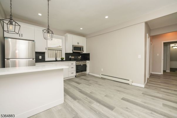 Interior, Kitchen, Pendant Lights, Recessed Lighting, Stainless Steel Appliances, Wood Texture Flooring