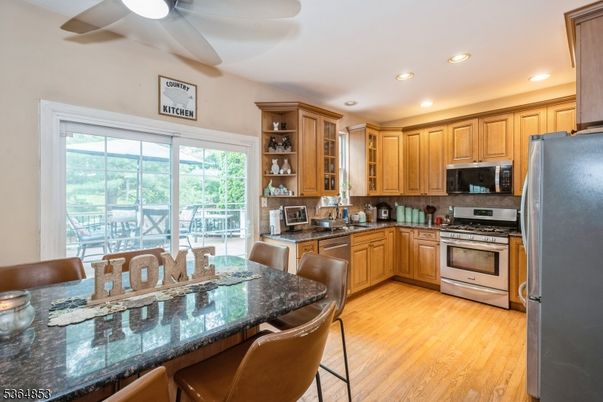 Dining room, Interior, Kitchen, Recessed Lighting, Stainless Steel Appliances, Wood Texture Flooring