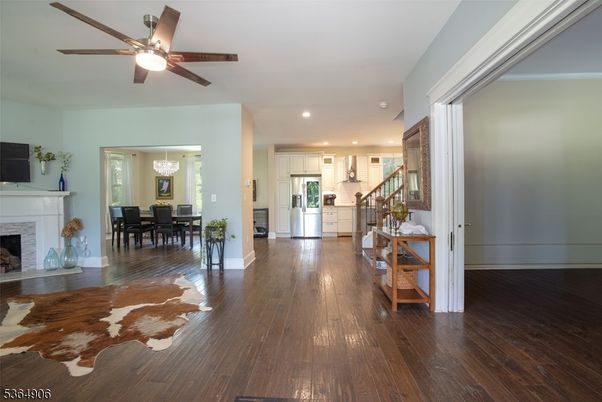 Chandelier, Dining room, Fireplace, Interior, Kitchen, Recessed Lighting, Stainless Steel Appliances, Wood Texture Flooring