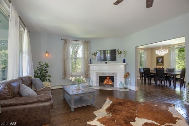 Chandelier, Dining room, Fireplace, Interior, Living room, Pendant Lights, Wood Texture Flooring