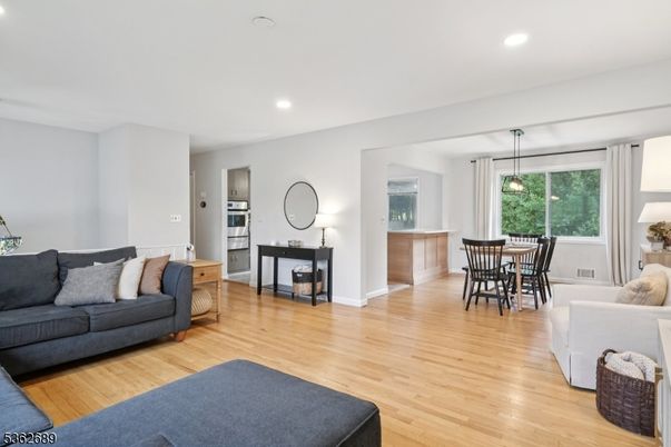 Dining room, Interior, Living room, Pendant Lights, Recessed Lighting, Stainless Steel Appliances, Wood Texture Flooring