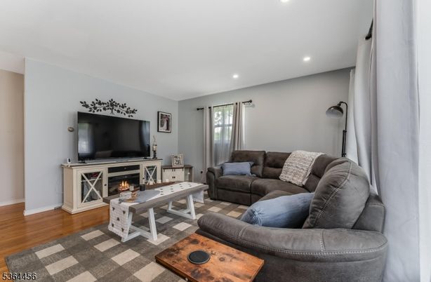Fireplace, Interior, Living room, Recessed Lighting, Wood Texture Flooring