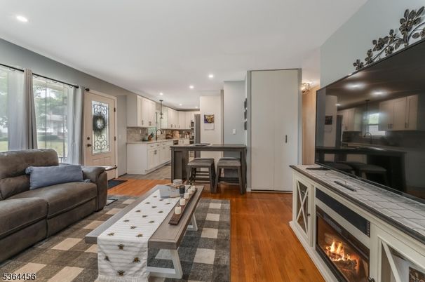 Fireplace, Interior, Kitchen, Living room, Recessed Lighting, Tile Countertops, Wood Texture Flooring