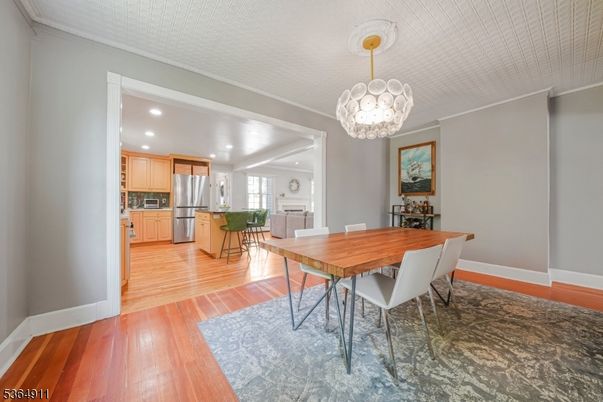 Chandelier, Dining room, Interior, Kitchen, Recessed Lighting, Stainless Steel Appliances, Wood Texture Flooring