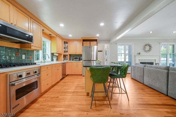 Fireplace, Interior, Kitchen, Living room, Recessed Lighting, Stainless Steel Appliances, Wood Texture Flooring