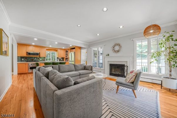 Fireplace, Interior, Kitchen, Living room, Recessed Lighting, Stainless Steel Appliances, Wood Texture Flooring