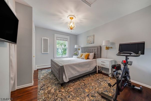 Bedroom, Chandelier, Fitness Equipment, Interior, Wood Texture Flooring